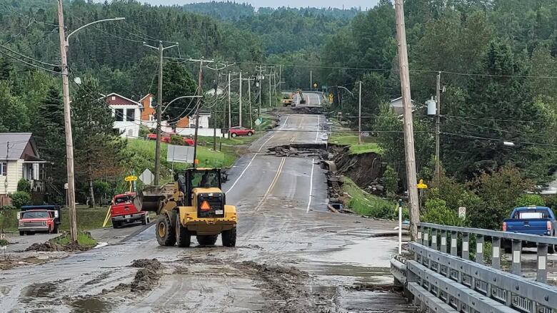 Mud overflows on damaged Route 170. 