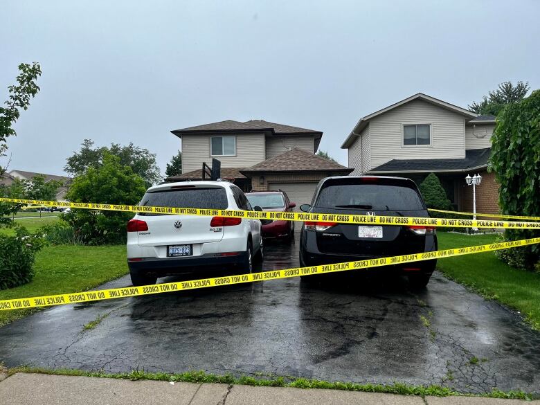 Police tape blocks off access to the home where police say a teen was stabbed at a family gathering on Sunday July 2, 2023.