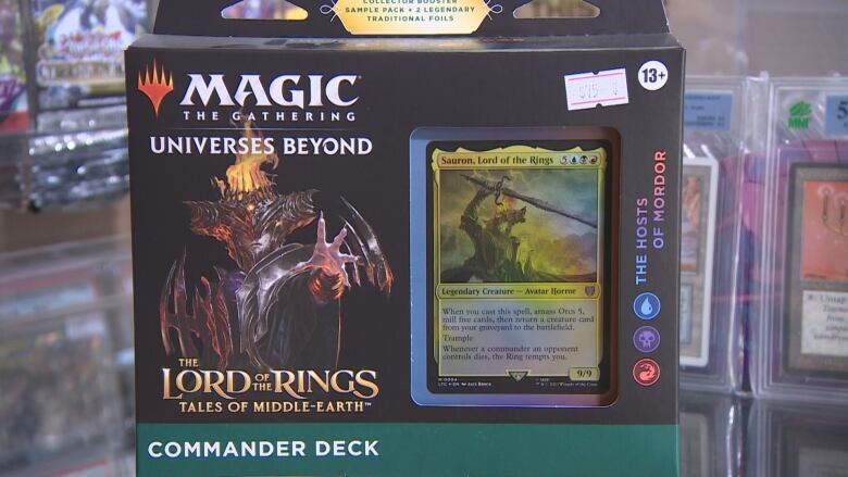 A package of fantasy cards sits on a display case.