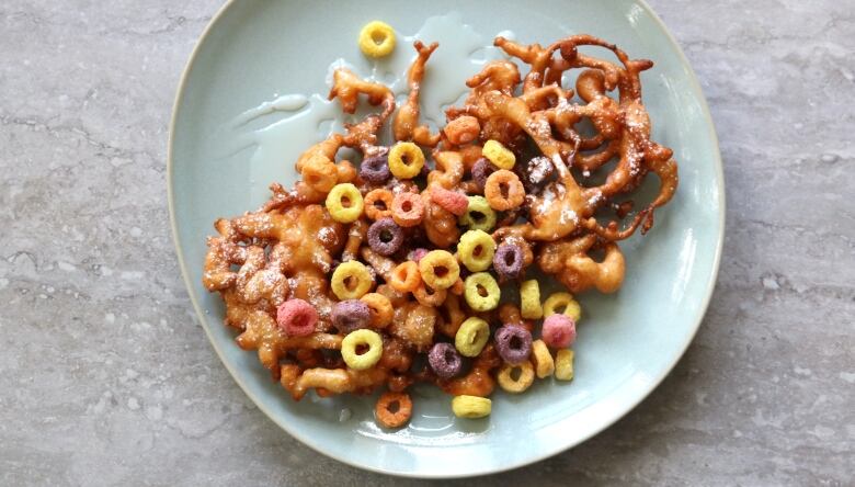 Froot Loop funnel cakes on a plate.