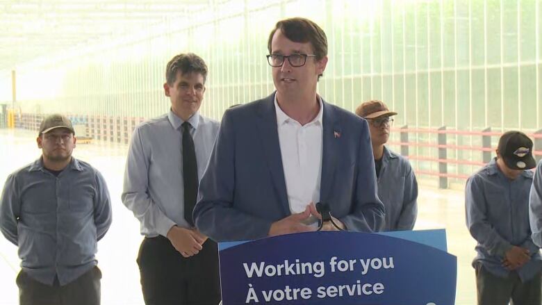 A man stands at a podium