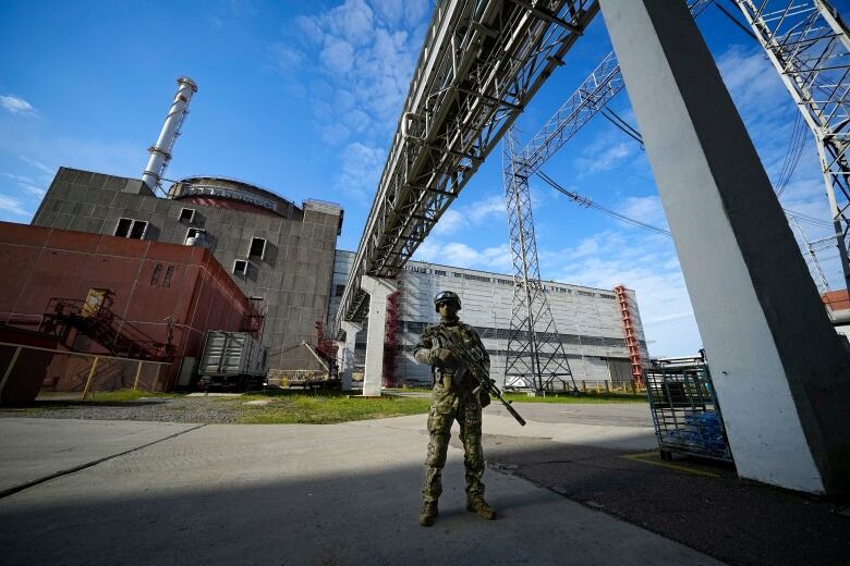 A Russian soldier standing guard at Ukraine's Zaporizhzhia nuclear power plant in May 2022.