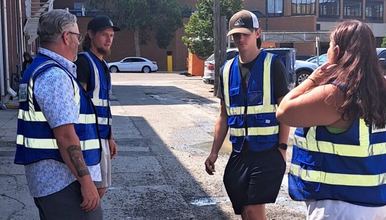 People are pictured wearing reflective vests.