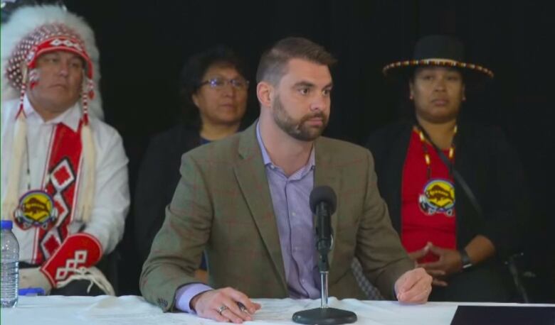 A man is pictured at a press conference.