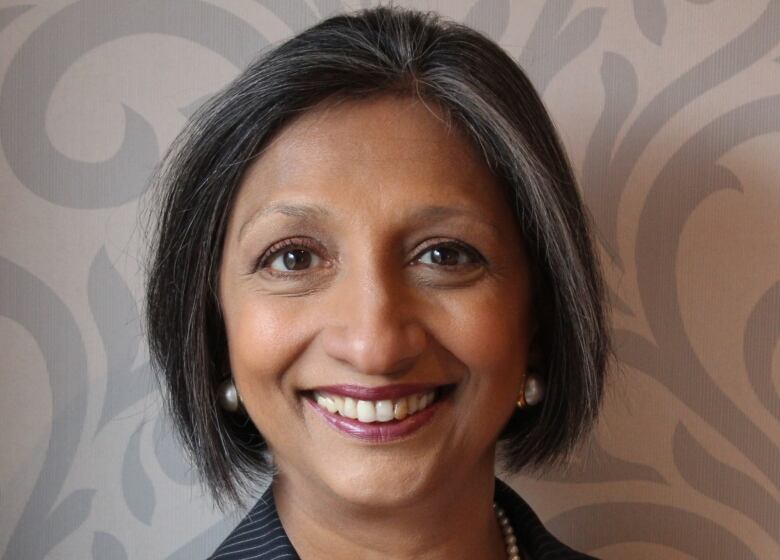 A woman smiles for the camera in a headshot.