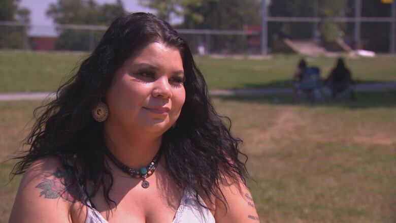 Crystal Wilson sits in a park in Surrey, B.C. 