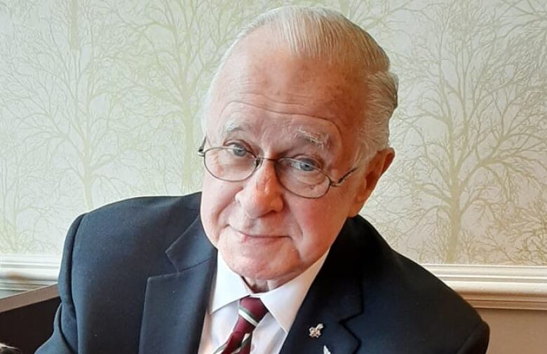 Headshot of a man in a suit