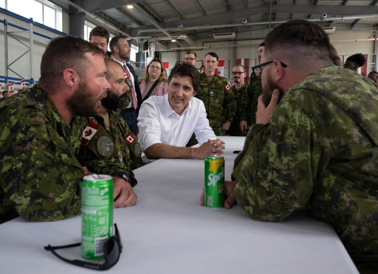 Prime Minister Justin Trudeau speaks with Canadian troops stationed at the Adazi military base on July 10, 2023 in Adazi, Latvia.