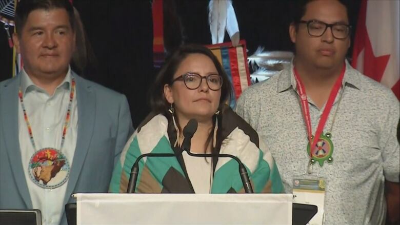 Connie walker with a blue and white starblanket wrapped around her