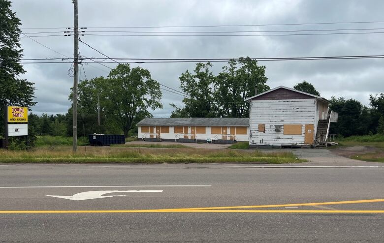 A boarded up roadside motel.