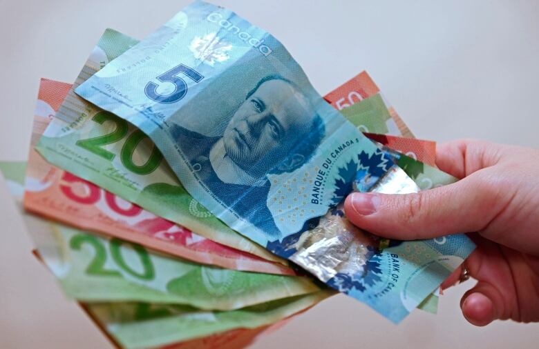 Canadian currency is pictured in Vancouver, B.C.