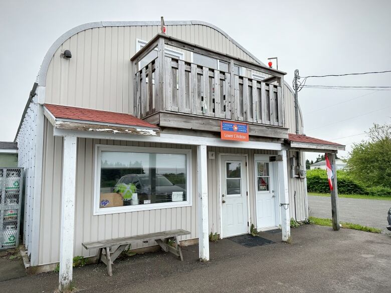 The front of a building is shown with a Canada Post sign over the entrance.