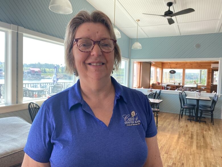 Phyllis car smiles at the camera in Carr's Oyster bar.