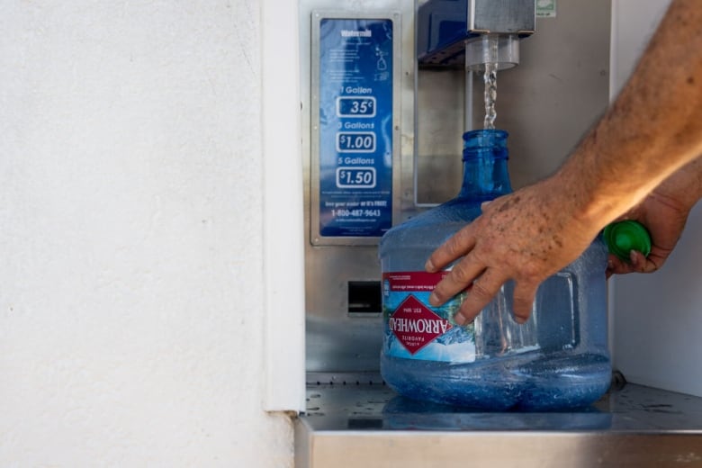 A close-up view of a water jug being filled in Phoenix, Arizona.