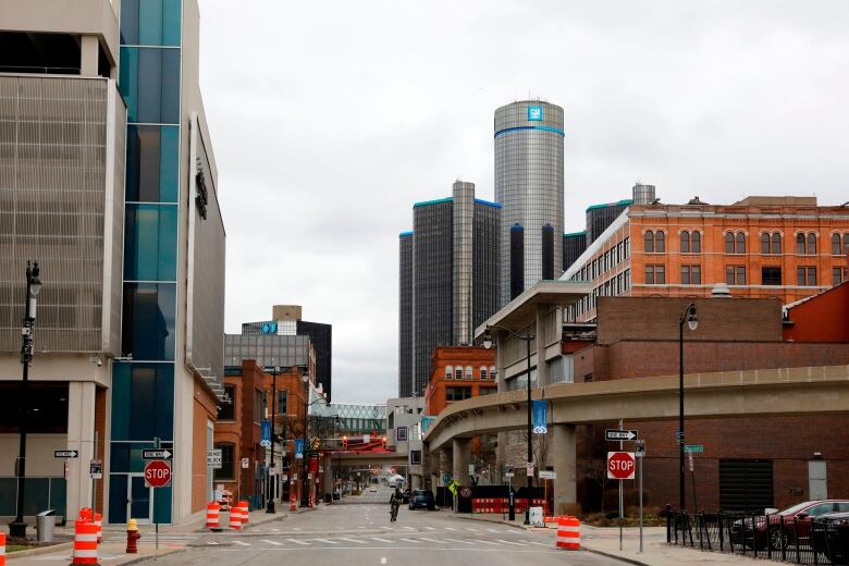 A city scape featuring modern and old buildings.