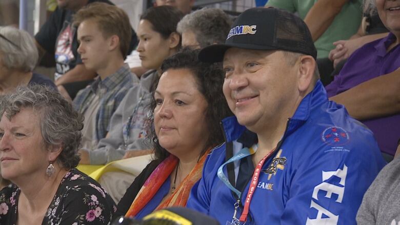 Dawn McGrath sits with family and friends as she watches her 15 year old son Maddex compete. 