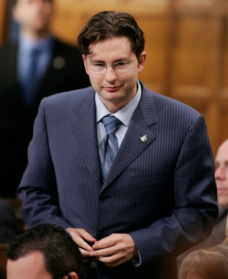 Conservative MP Pierre Poilievre rises in the House of Commons to apologize for making an obscene gesture yesterday