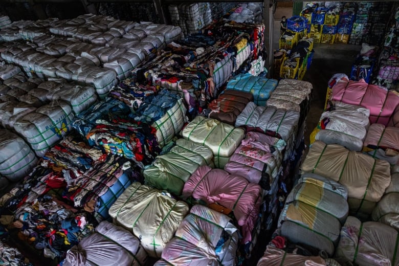 Bales of sorted second-hand clothes are seen being piled up at a facility operated by Zheng-chuan textile recycling factory on July 15, 2022 in New Taipei City, Taiwan. 