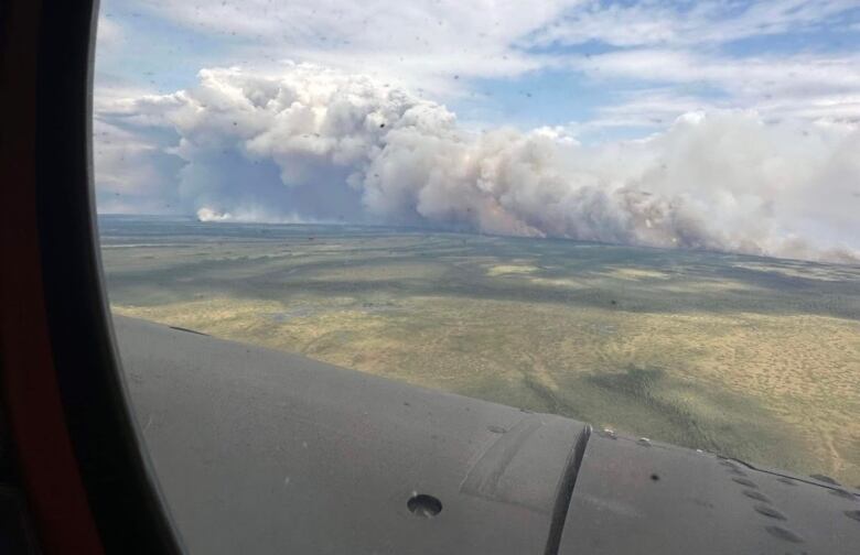 View of heavy smoke from an aerial view from a plane window