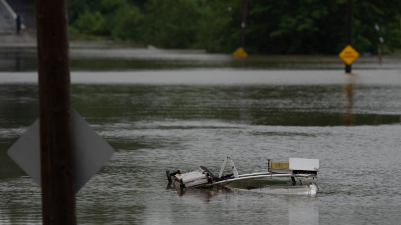 The top of a service truck is seen abandoned in floodwater following a major rain event in Halifax on Saturday, July 22, 2023.