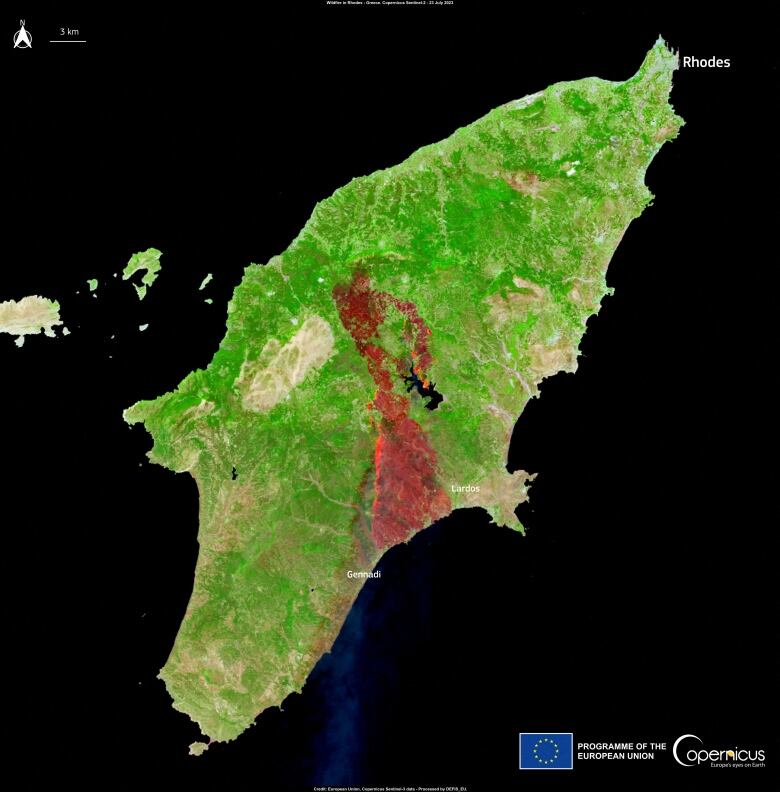 An satellite image of an island in green with a big chunk of red in the centre, near two villages labelled 