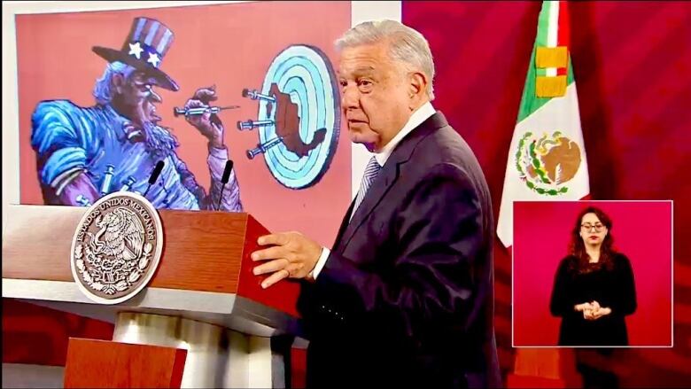 President Lopez Obrador shows a cartoon at his 'maanera' news conference on April 17. Amlo has used the daily conferences to deny that Mexico is the source of most of the fentanyl entering Canada and the US.