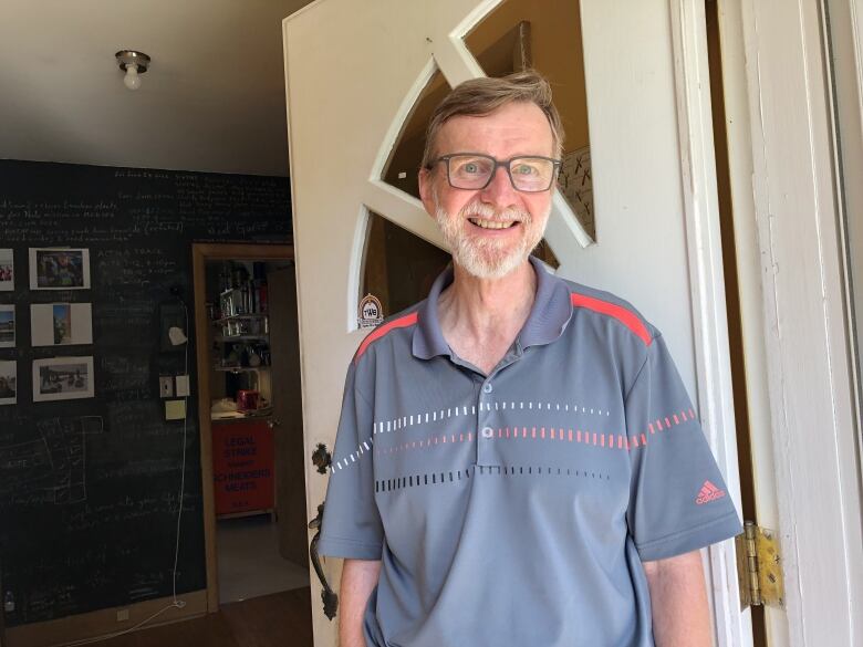 smiling man with silver beard