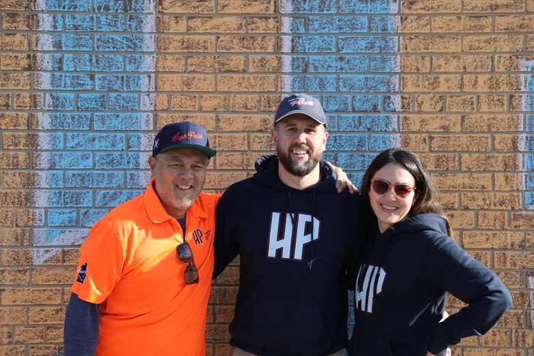 Jason Okamura (left) is seen with High Park Little League colleagues Gareth Ringrose and Tracy Platt (right). Okamura said not having car access creates a safety issue when trying to pick up young children from baseball practice at night in the park. 