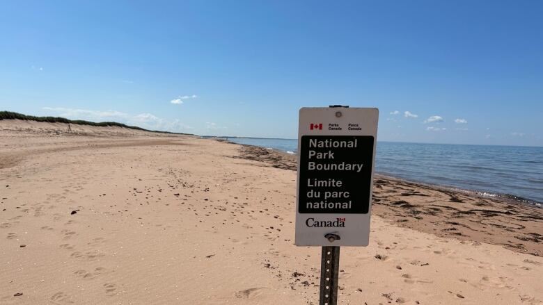 National Park sign on beach.