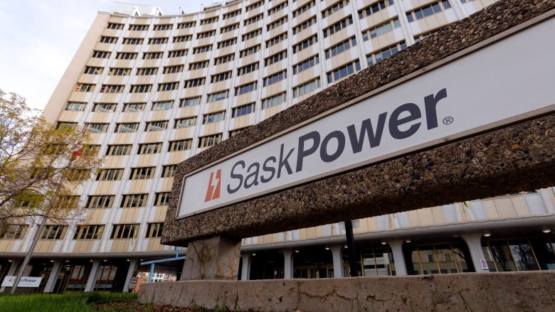 A board that says SaskPower with a building behind. 