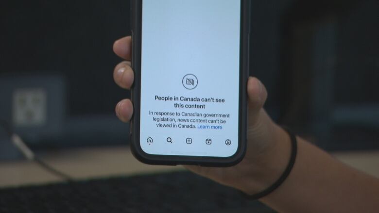 A screengrab from a cellphone of the Instagram App shows a white screen with a camera icon that has a line through it and the message: 'People in Canada cant see this content. In response to Canadian government legislation, news content cant be viewed in Canada.'