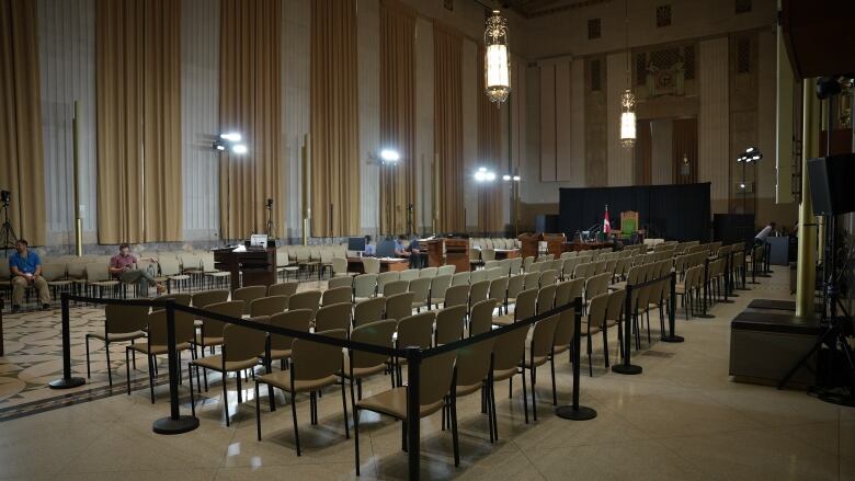 Stackable chairs line the aisle of a makeshift House of Commons in the Sir John A. MacDaonald building in Ottawa.