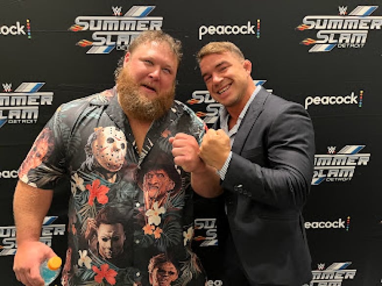 Otis and Chad Gable of World Wrestling Entertainment (WWE) show their fists during a media availability in Detroit, Mi., ahead of SummerSlam at Ford Field on Saturday.