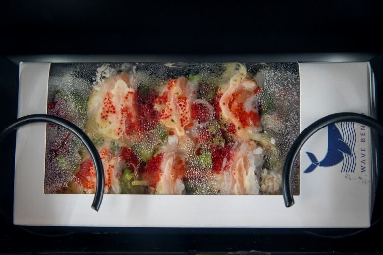 A box of sushi on sale in a vending machine at a Coquitlam SkyTrain station.