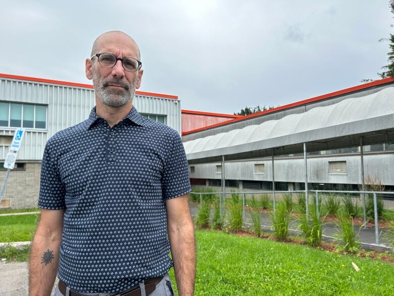 man in front of building