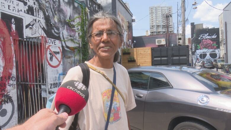 Steven Mull has been friends with Feather Hat Guy since moving to Windsor 15 years ago and says Ron LaDouceur loved the city and never spoke poorly of it.