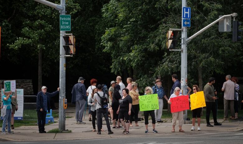 A group of mostly-seniors protests proposed car ban in High Park, citing mobility/access issues, on Aug. 8, 2023.