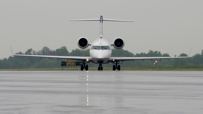 A plane taxi's to the airport after landing.