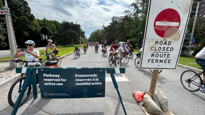 cyclists during bike rally on Queen Elizabeth Driveway, August 12, 2023