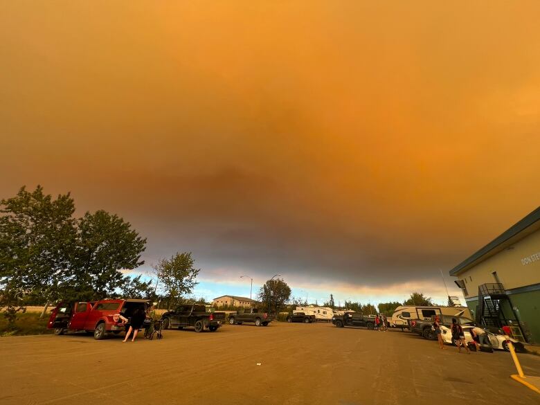 Smoke in the sky above vehicles