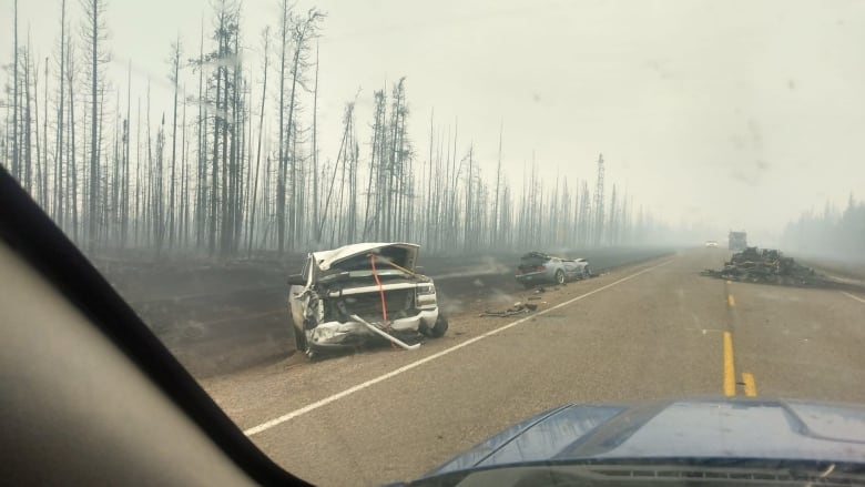 Burned vehicles on the highway outside Enterprise, N.W.T. on Monday.