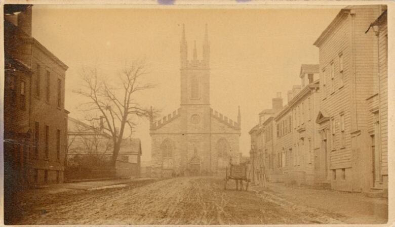 An 1865 photo of Stone Church in Saint John and a horse and buggy in the foreground. 