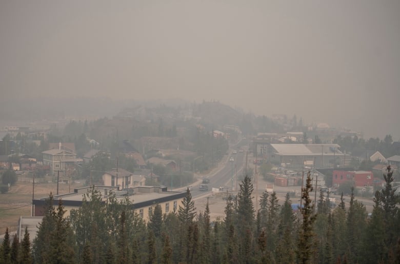 Smoke from a wildfire blankets the sky over Yellowknife.