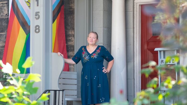 A person standing in front of a house.