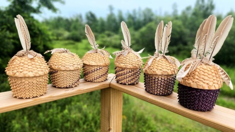 Six Haudenosaunee Gustowas representing each of the Six Nations made from black ash.