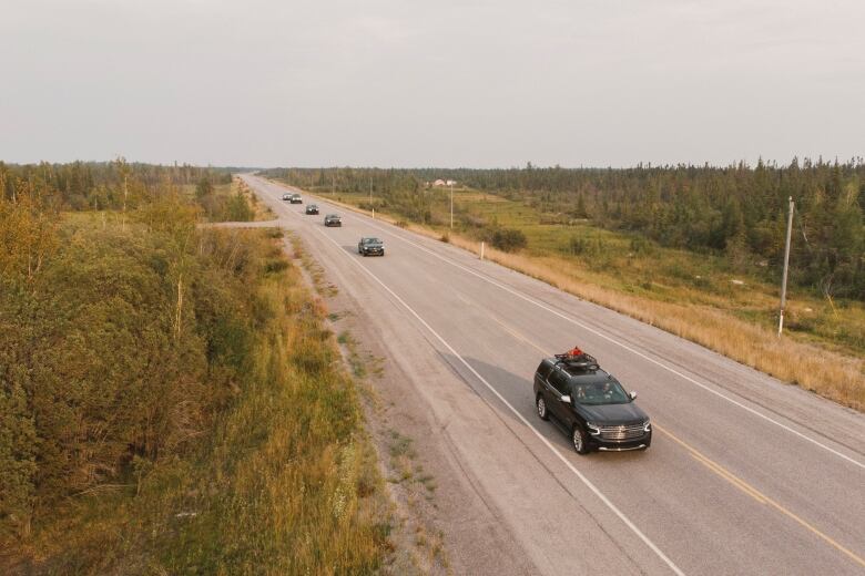 Yellowknife residents are seen driving out of the city on Highway 3, following an evacuation order prompted by a wildfire burning west of the territorial capital.