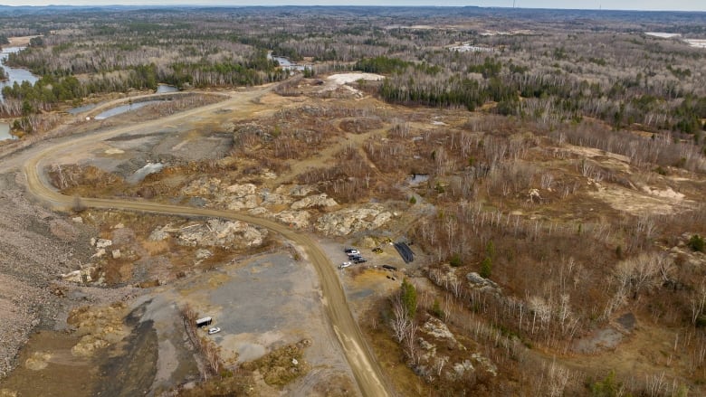 An aerial photo of a northern Ontario landscape, with some disturbed areas and roads