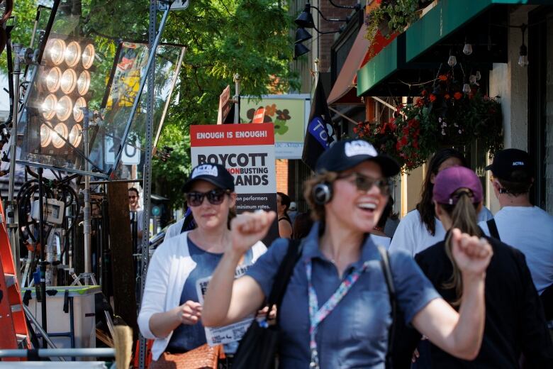 A picket line on the street outside of a commercial set.