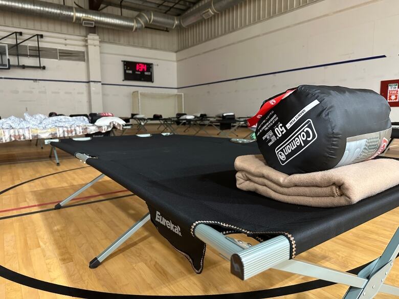 A cot in a gymnasium. 