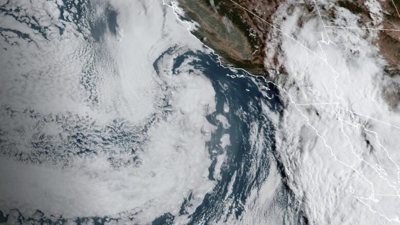 A satellite image of a storm approaching Mexico's Pacific coast.